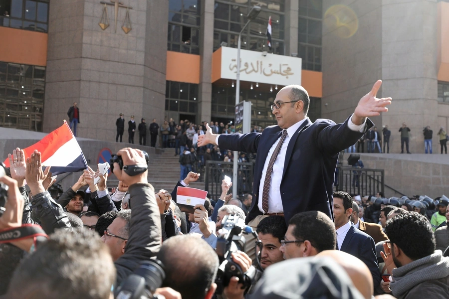 Egyptian lawyer and ex-presidential candidate Khaled Ali (center), who is marching in support of a ruling against the Egypt-Saudi border demarcation agreement, reacts in front of the State Council courthouse in Cairo (Mohamed Abdel Ghany/Reuters).
