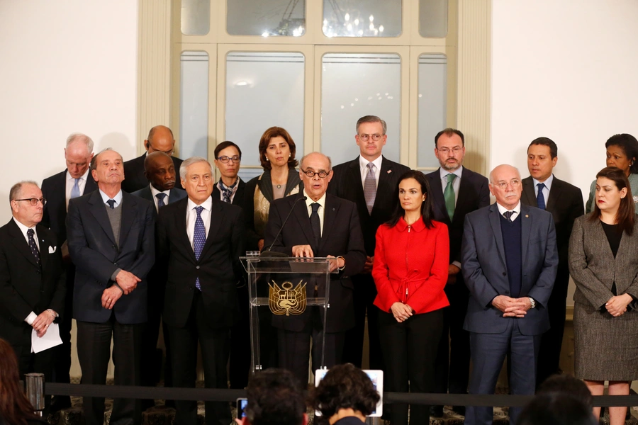 Peru's Foreign Minister Ricardo Luna (C) along with foreign ministers and representatives from across the Americas, give a news conference after a meeting to discuss issues related to the Venezuelan crisis, in Lima, Peru, August 8, 2017.