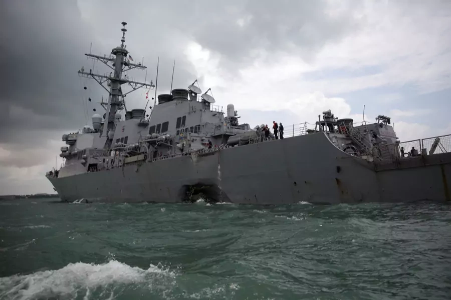 The U.S. Navy guided-missile destroyer USS John S. McCain is seen after a collision. 