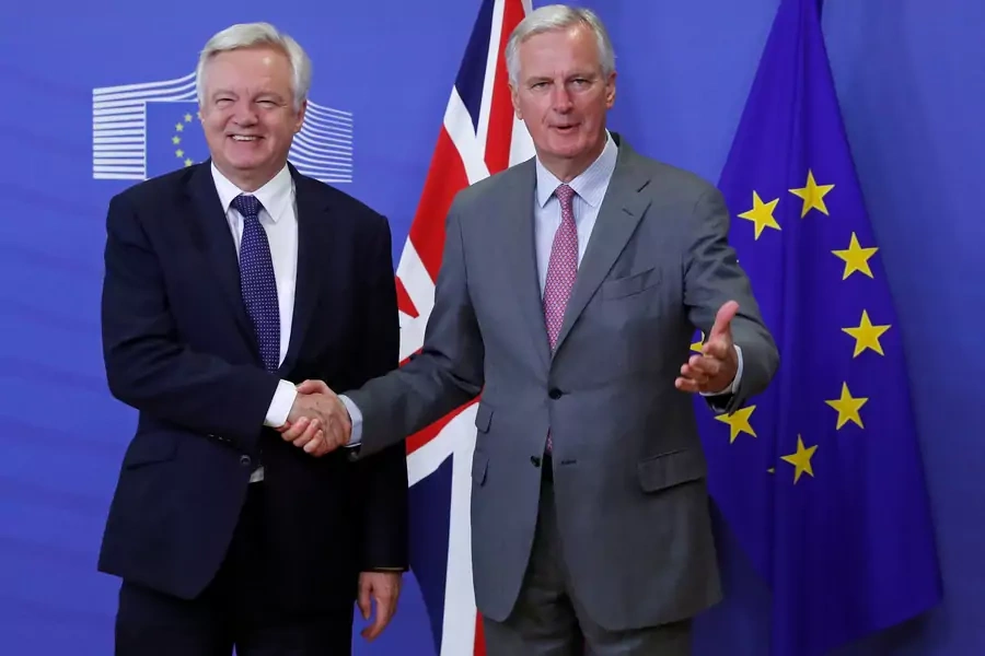 UK Secretary of State for Exiting the European Union David Davis (L) is welcomed by the European Commission's Chief Brexit Negotiator Michel Barnier.