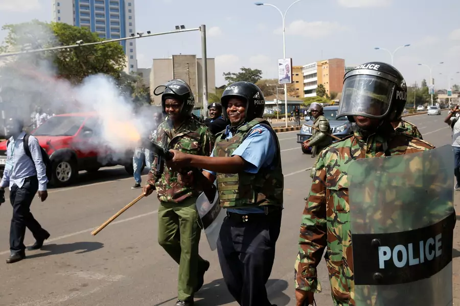 A Kenyan riot policemen fires tear gas to disperse supporters of the opposition NASA coalition during a demonstration in Nairobi, Kenya September 26, 2017. Kenya will face a constitutional crisis should valid elections not be held before October 31.