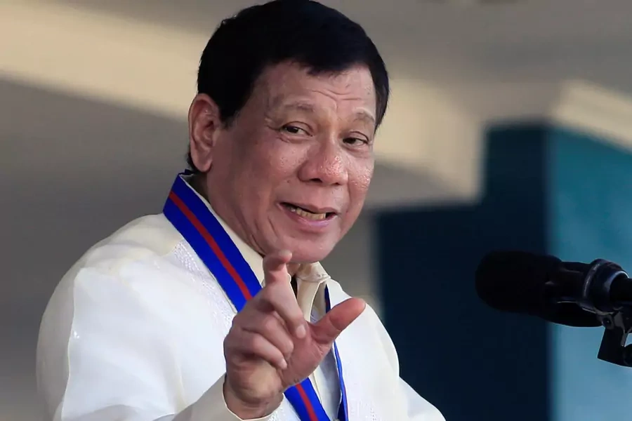 Philippine President Rodrigo Duterte gestures as he delivers his speech during the 116th Police Service Anniversary inside the Philippine National Police (PNP) headquarters in Quezon city, metro Manila, Philippines on August 9, 2017.