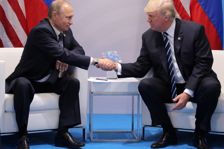 President Donald Trump shakes hands with Russia's President Vladimir Putin.