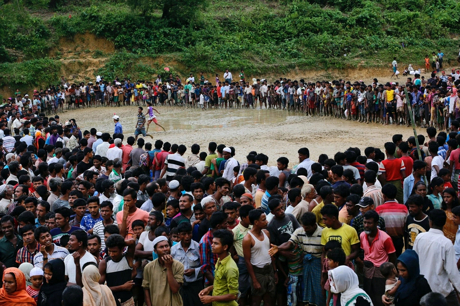 Rohingya refugees wait for aid in Cox's Bazaar, Bangladesh September 20, 2017.