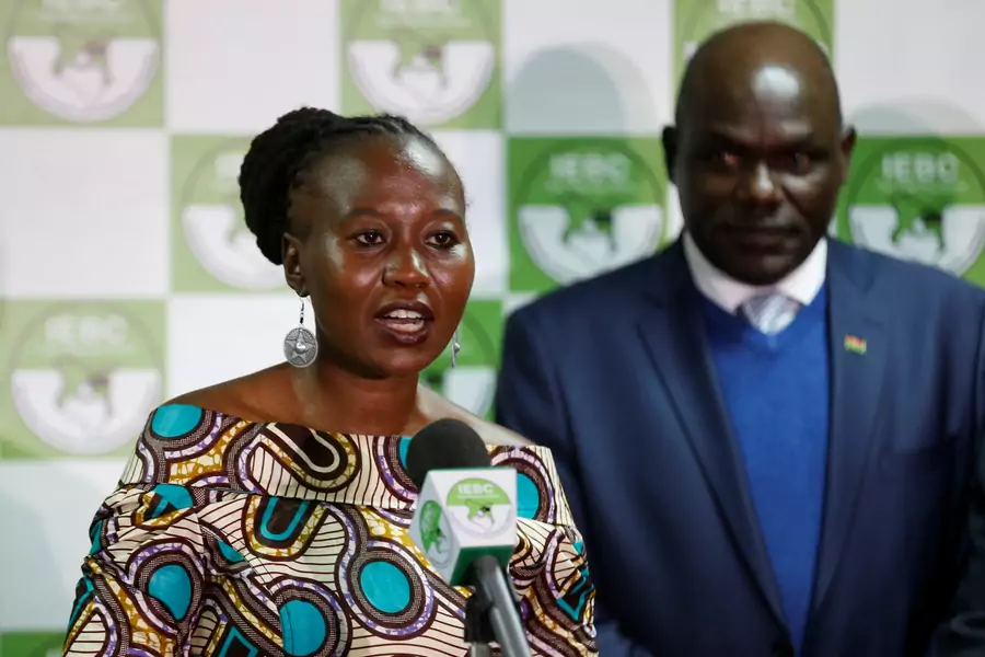 Kenyan IEBC commissioner Roselyn Akombe, who recently fled Kenya after receiving death threats, flanked by chairman Wafula Chebukati, addresses a news conference at their offices in Nairobi, Kenya, July 6, 2017. Picture taken July 6, 2017.