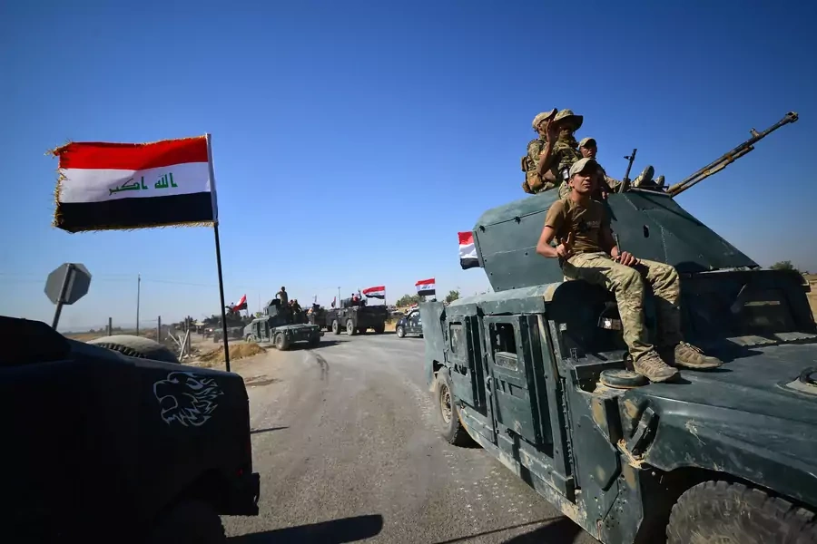 Members of Iraqi federal forces gather to continue to advance in military vehicles in Kirkuk on October 16, 2017 (REUTERS/Stringer).