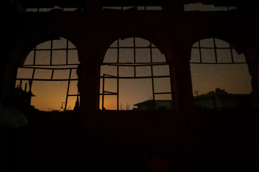 The night sky is seen through damaged windows in the rebel-controlled town of Binnish in Idlib province, Syria September 7, 2016 (REUTERS/Ammar Abdullah)
