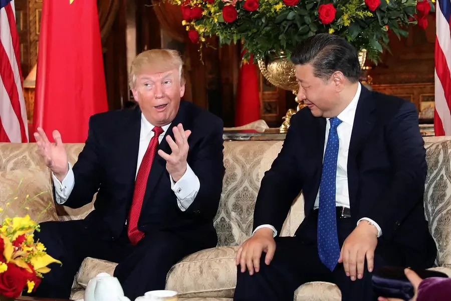 U.S. President Donald Trump interacts with Chinese President Xi Jinping at Mar-a-Lago state in Palm Beach, Florida, U.S., April 6, 2017.