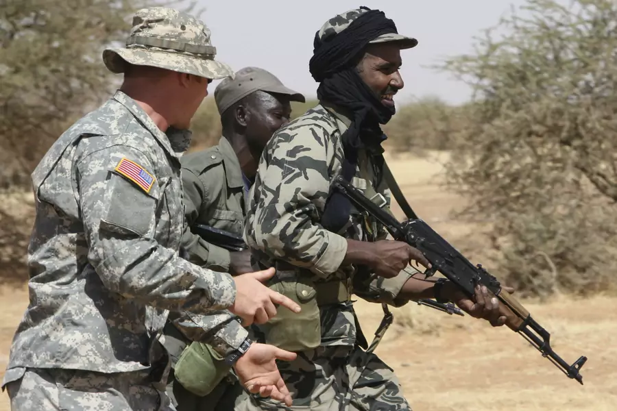 A U.S. soldier directs Malian soldiers while training in Gao, eastern Mali, on November 13, 2006. The Trans-Sahara Counterterrorism Partnership also includes Algeria, Burkina Faso, Cameroon, Chad, Mauritania, Morocco, Niger, Nigeria, Senegal, and Tunisia.