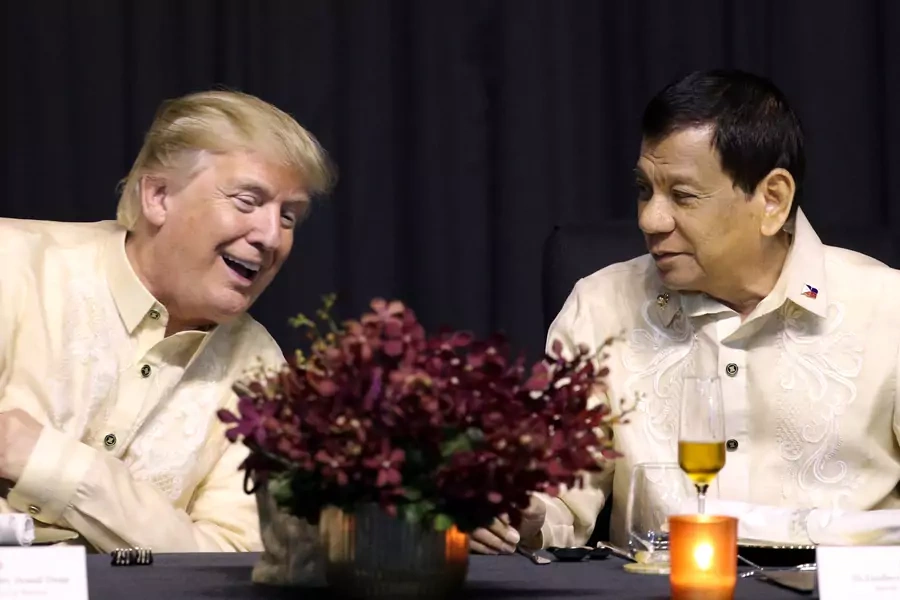 U.S. President Donald J. Trump speaks with Philippines President Rodrigo Duterte during the gala dinner marking ASEAN's 50th anniversary in Manila, Philippines, on November 12, 2017. 