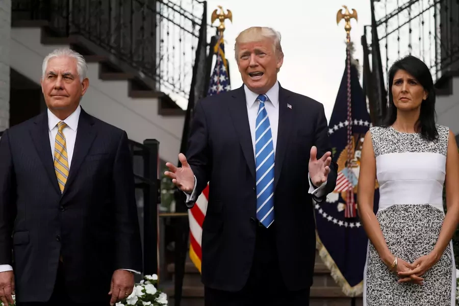 U.S. President Donald Trump, flanked by Secretary of State Rex Tillerson (L) and U.S. Ambassador to the United Nations Nikki Haley (R) speaks to reporters after their meeting at Trump's golf estate in Bedminster, New Jersey U.S. August 11, 2017.