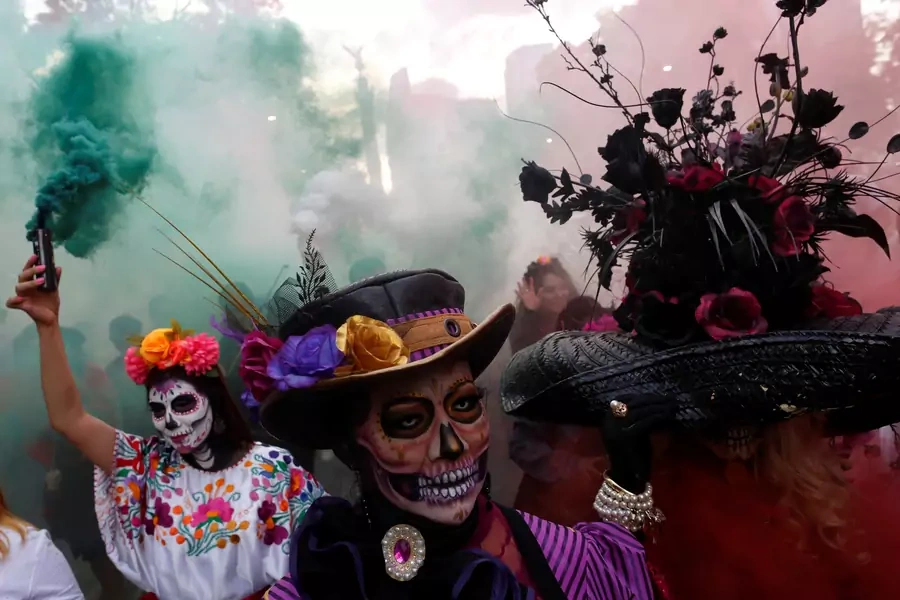 Women dressed up as Catrina, a Mexican character also known as "The Elegant Death", take part in a parade in Mexico City, Mexico October 22, 2017. Hundreds in the city used the celebrations to call attention to gender-based violence. 