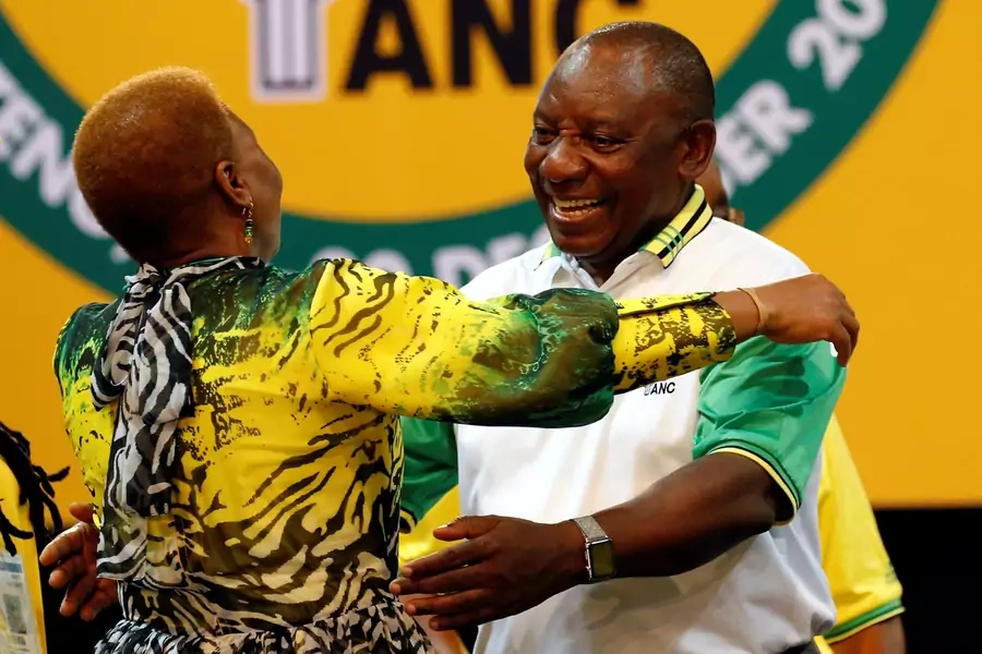 Deputy president of South Africa Cyril Ramaphosa greets an ANC member during the 54th National Conference of the ruling African National Congress (ANC) at the Nasrec Expo Centre in Johannesburg, South Africa December 18, 2017.