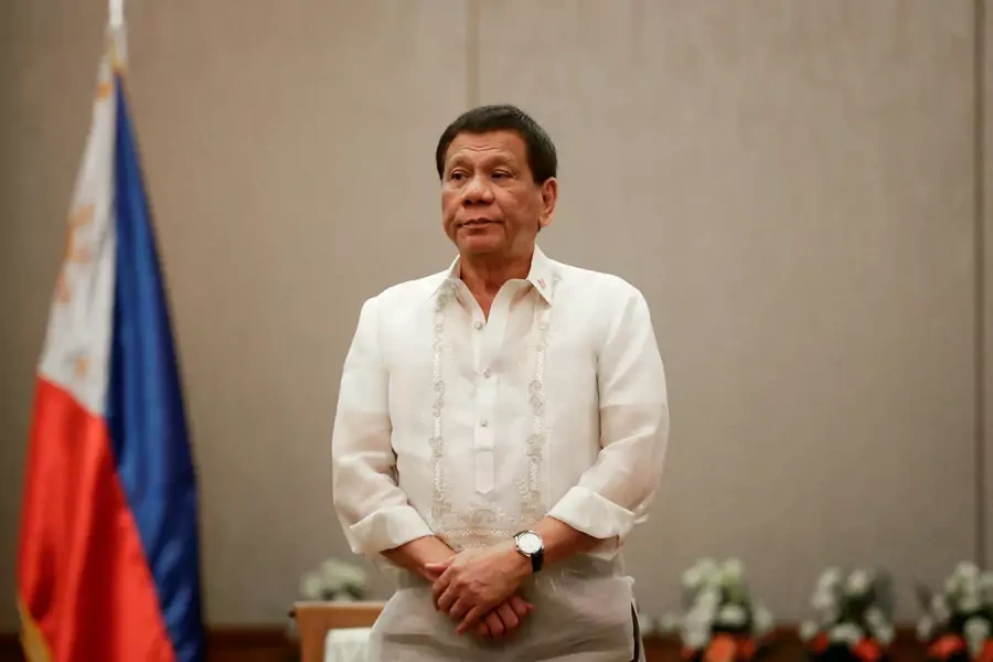 Philippines' President Rodrigo Duterte stands at attention during a courtesy call with the Association of Southeast Asian Nations Economic Ministers in Manila, Philippines, on September 6, 2017.