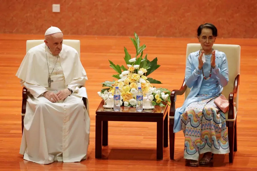 Myanmar’s State Counsellor Aung San Suu Kyi applauds next to Pope Francis as they attend a meeting with members of the civil society and diplomatic corps in Naypyitaw, Myanmar on November 28, 2017. 