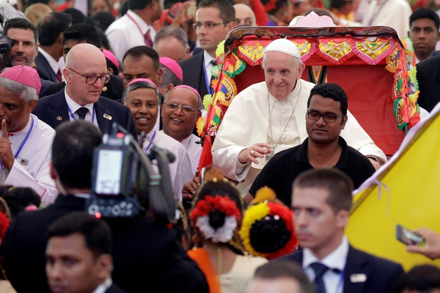 Pope Francis rides a rickshaw as he visits St. Mary’s Cathedral in Dhaka, Bangladesh, December 1, 2017.