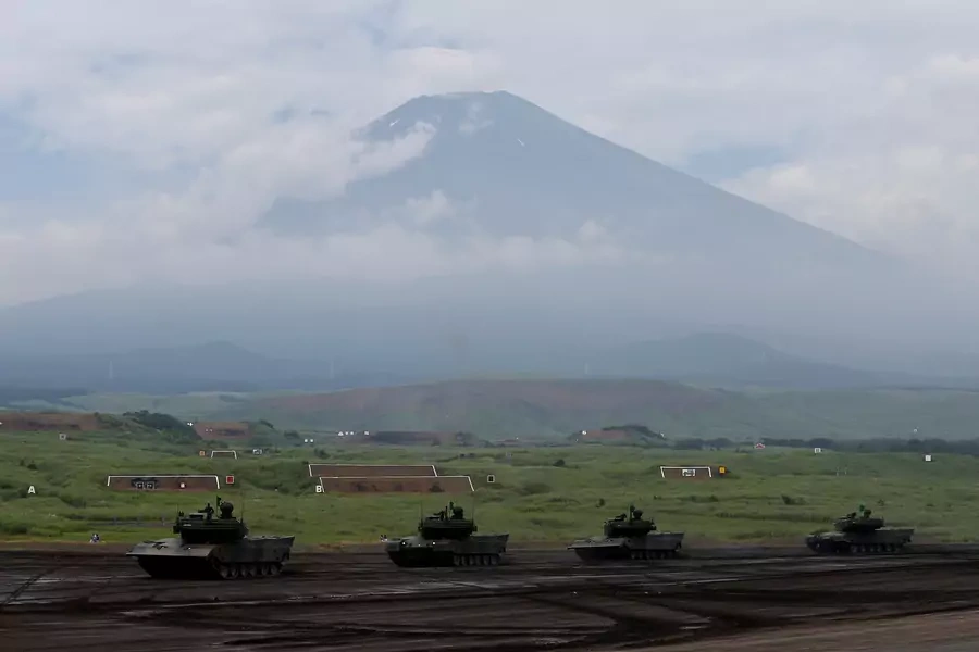 Japanese Ground Self-Defense Force tanks take part in an annual training session with Mount Fuji in the background at Higashifuji training field in Gotemba, Japan August 24, 2017.