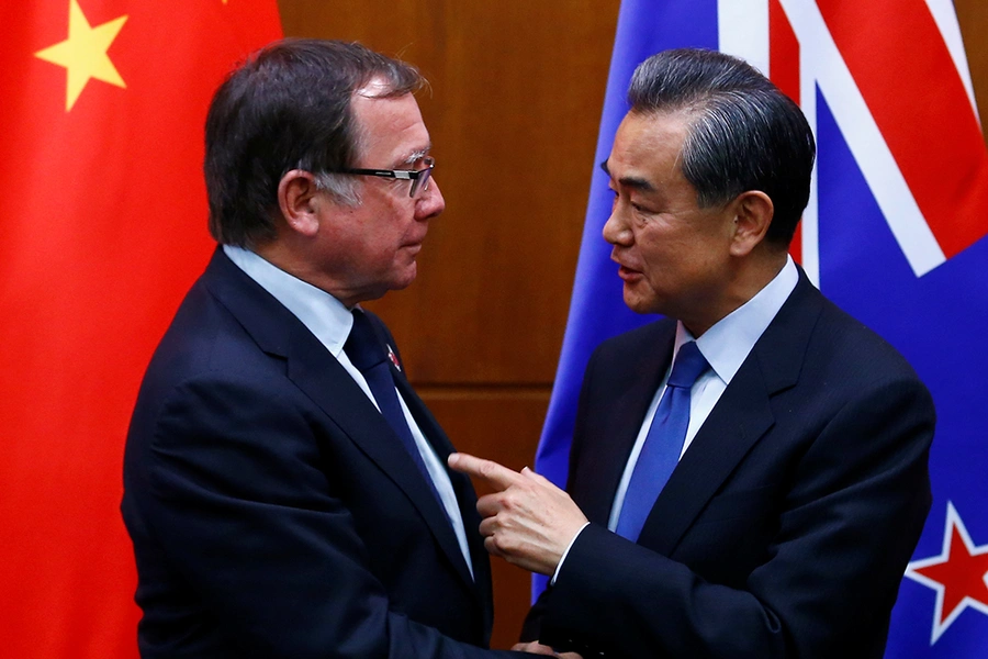 Chinese Foreign Minister Wang Yi (R) and New Zealand's Foreign Minister Murray McCully attend a news conference after talks in Beijing, China, on October 18, 2016.