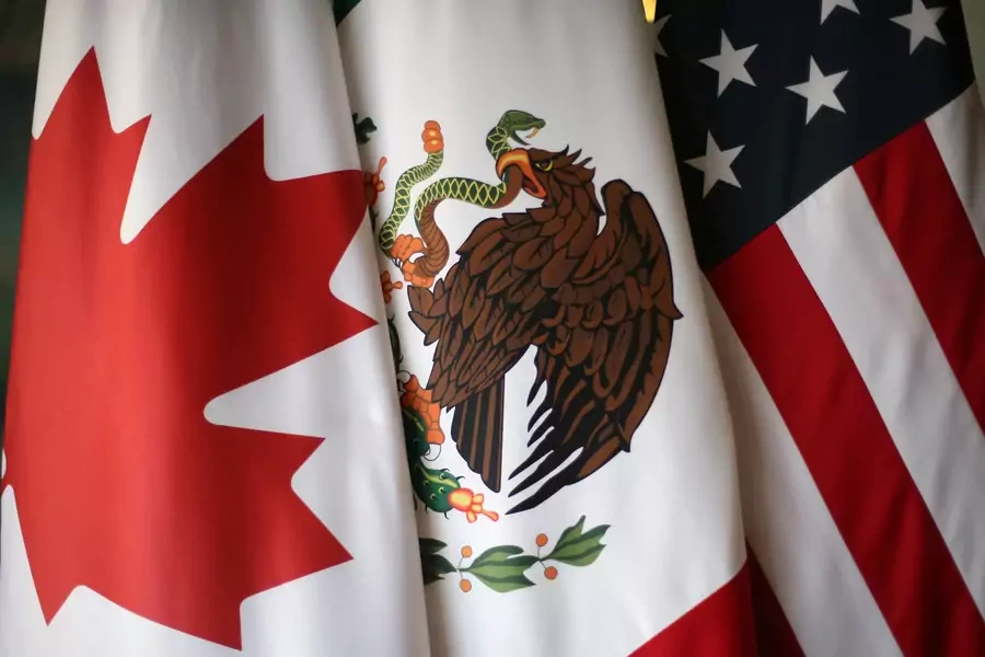 Flags are pictured during the fifth round of NAFTA talks involving the United States, Mexico and Canada, in Mexico City, Mexico, November 19, 2017.