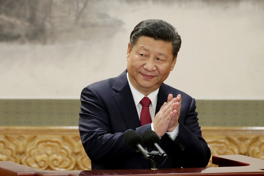 China's President Xi Jinping claps after his speech as he and other new Politburo Standing Committee members meet with the press at the Great Hall of the People in Beijing, China October 25, 2017. 