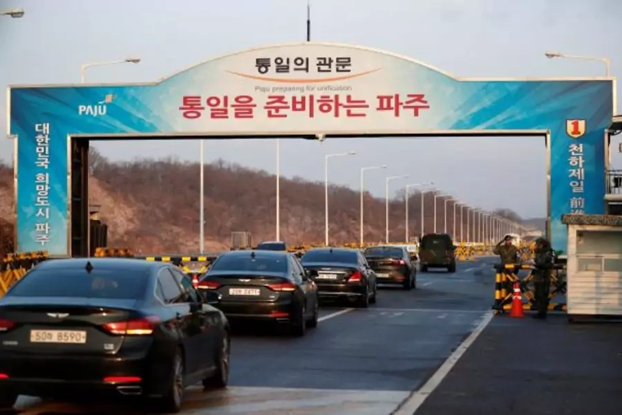 Vehicles transporting the South Korean delegation led by Cho Myoung-gyon, Minister of South Korean Unification Ministry, drive past a checkpoint on the Grand Unification Bridge.