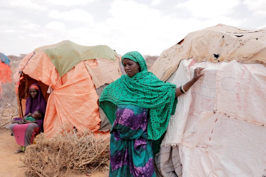 A pregnant young woman stands beside her shelter at a makeshift settlement in Bardihahle near Burao, northwestern Togdheer region of Somaliland March 26, 2017