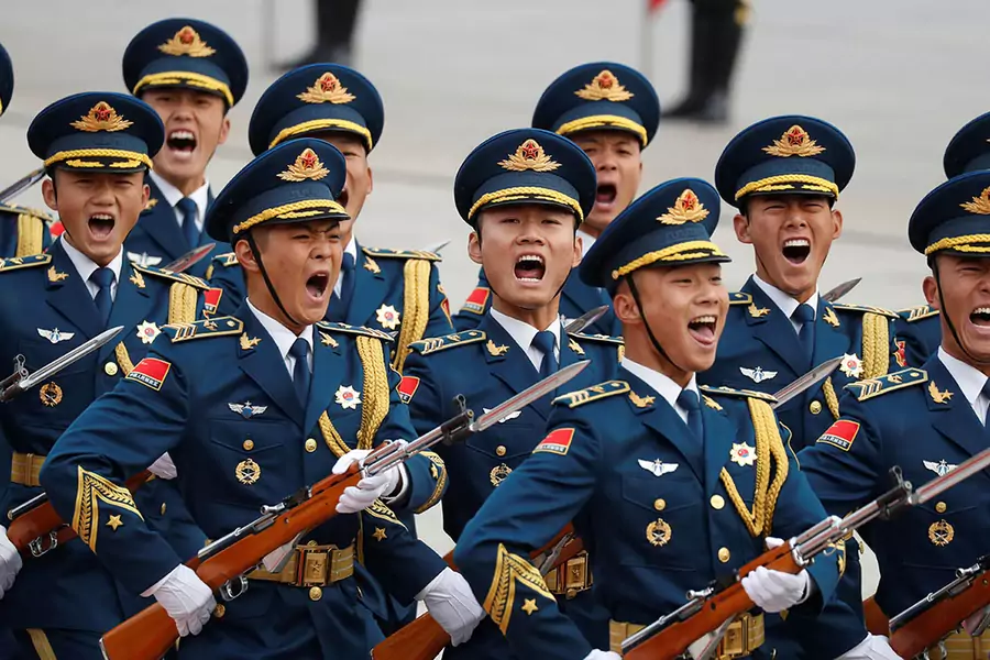 Military troops march during a welcoming ceremony for U.S. President Donald Trump in Beijing, China. November 9, 2017.