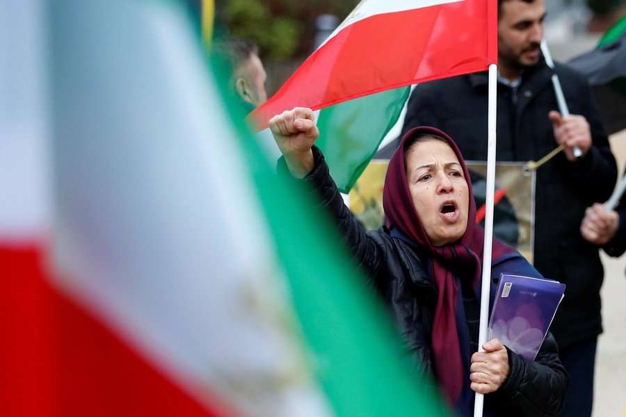 An opponent of Iranian President Hassan Rouhani chants slogans during a protest outside the European Union Council in Brussels, Belgium January 3, 2018. 