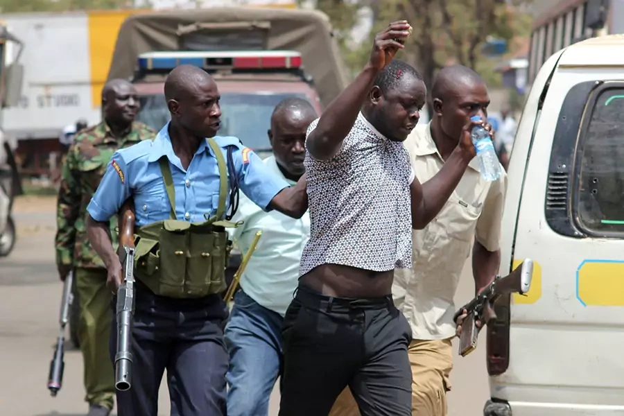 Riot police detain a supporter of Kenyan opposition leader Raila Odinga of the National Super Alliance (NASA) coalition protesting against the treason charges on lawyer Miguna Miguna in the streets of Kisumu, Kenya February 6, 2018.