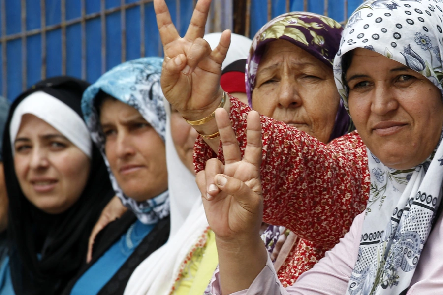 Displaced Syrian refugee women gather at the Yayladagi refugee camp in Hatay province near the Turkish-Syrian border July 9, 2012.