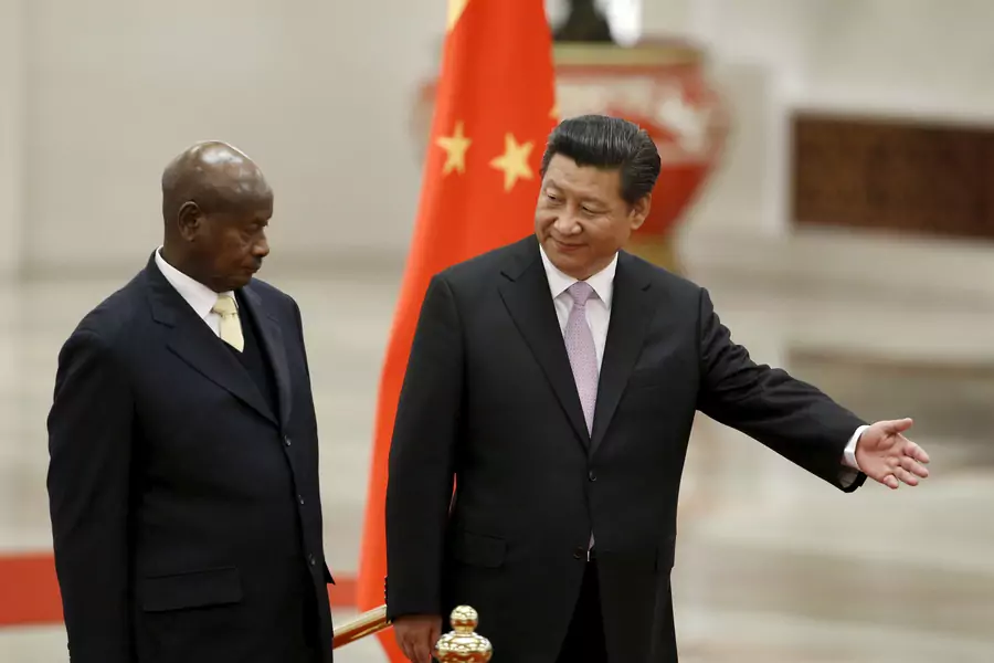 Ugandan President Yoweri Museveni and Chinese President Xi Jinping attend a welcoming ceremony at the Great Hall of the People in Beijing, March 31, 2015. Museveni has been in power since 1986 and oversaw the removal of presidential term and age limits.