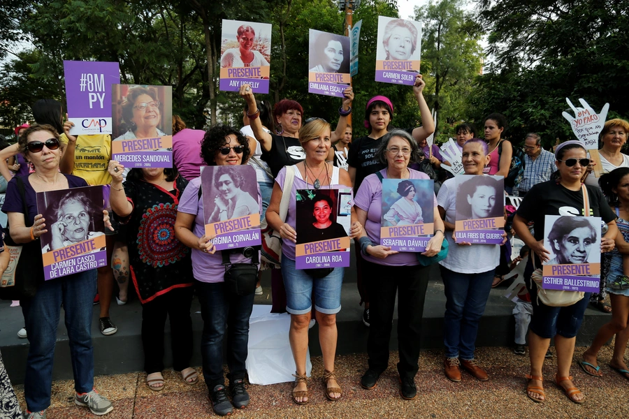 Women participate in a demonstration as part of International Women's Day in Asuncion, Paraguay, March 8, 2018.