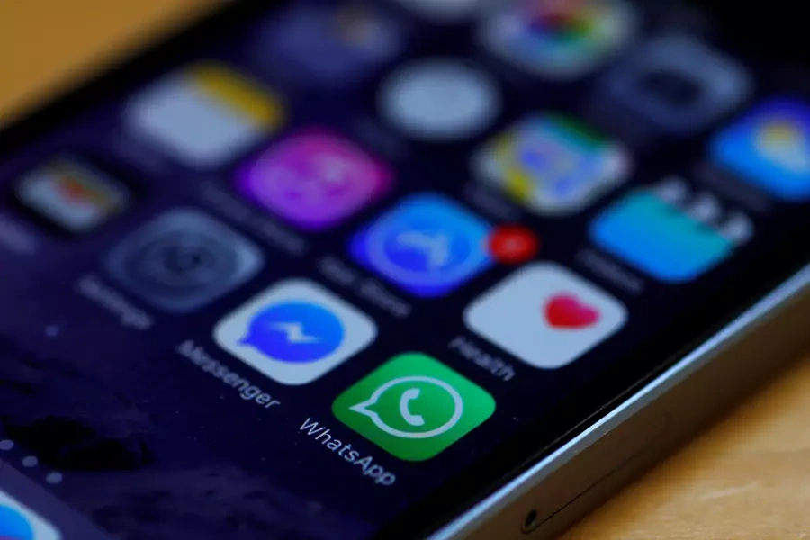 WhatsApp and Facebook messenger icons are seen on an iPhone in Manchester, Britain.