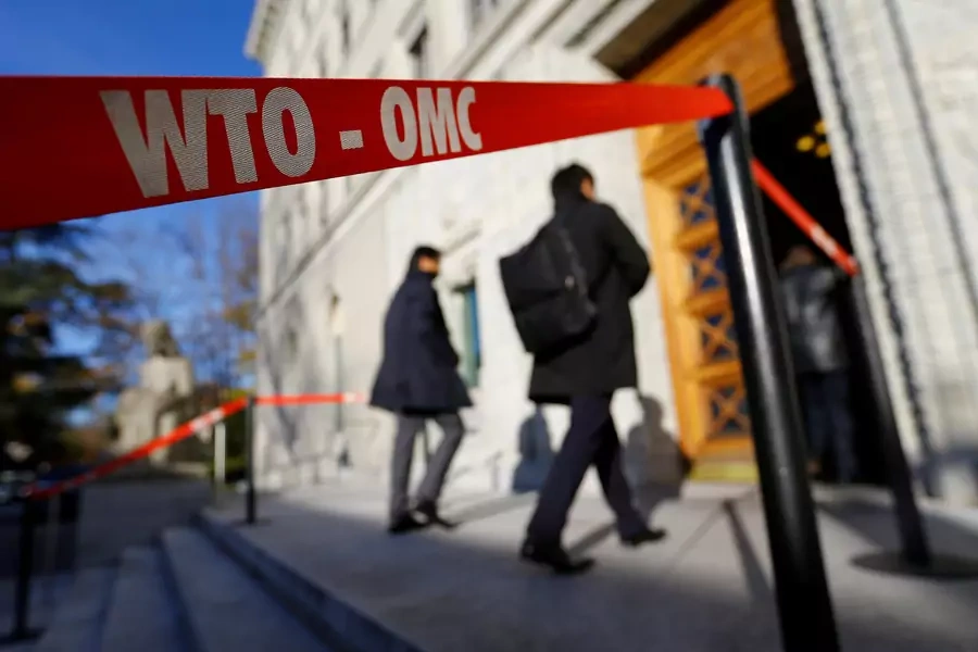 Delegates arrive at the World Trade Organization (WTO) headquarters in Geneva, Switzerland