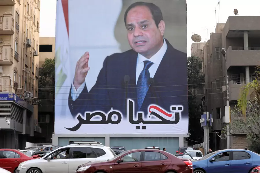 Cars pass by a poster of Egypt's President Abdel Fattah al-Sisi for the upcoming presidential election, in Cairo, Egypt, February 19, 2018. The writing on the poster reads: "Long live Egypt".
