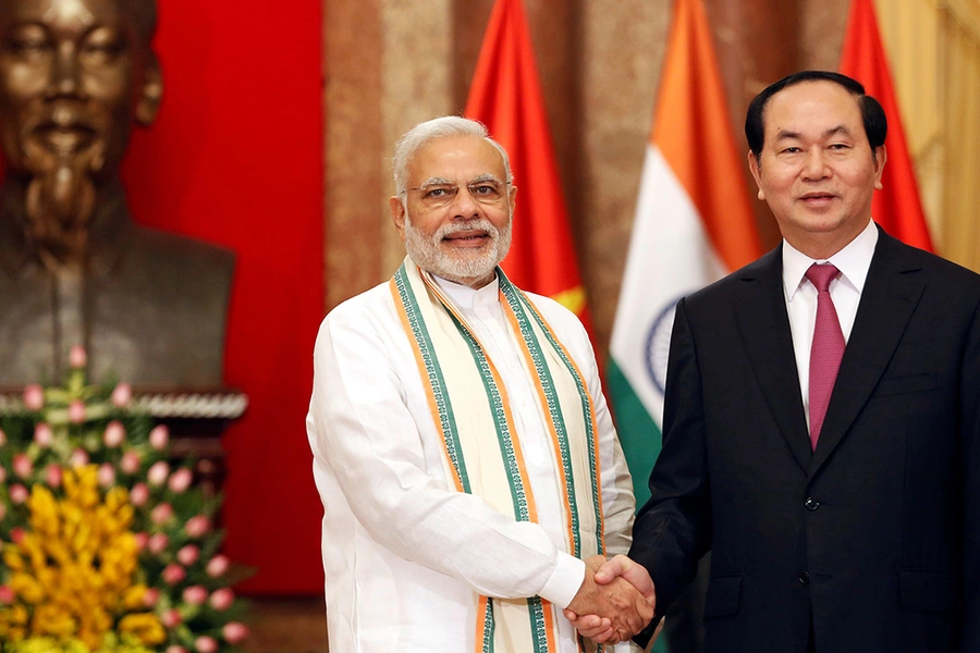 India's Prime Minister Narendra Modi poses for a photo with Vietnam's President Tran Dai Quang in front of a statue of late Vietnamese revolutionary leader Ho Chi Minh at the Presidential Palace in Hanoi, Vietnam on September 3, 2016.