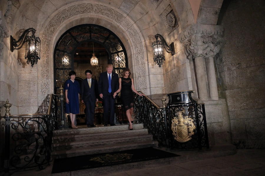 U.S. President Donald Trump, First Lady Melania Trump, Japanese Prime Minister Shinzo Abe, and his wife Akie Abe pose for a photograph before attending dinner at Mar-a-Lago Club in Palm Beach, Florida, on February 11, 2017.