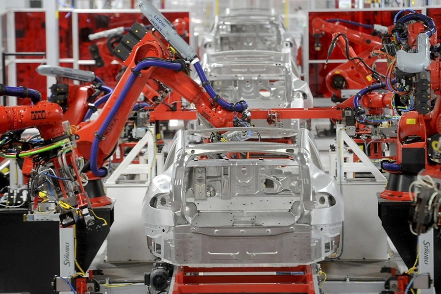 Robotic arms assemble Tesla's Model S sedans at the company's factory in Fremont, California, on June 22, 2012. 