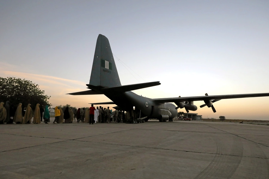 Some of the newly released Dapchi schoolgirls board a plane at the air force base in Maiduguri, Nigeria March 21, 2018. The kidnappers and the Nigerian government deny that a ransom was paid or that prisoners were exchanged.