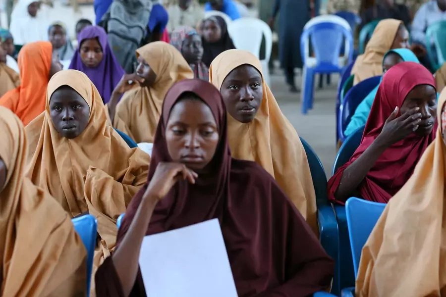 A group of newly-released Dapchi school girls at the air force base in Maiduguri, Nigeria, waiting to board a plane, March 21, 2018