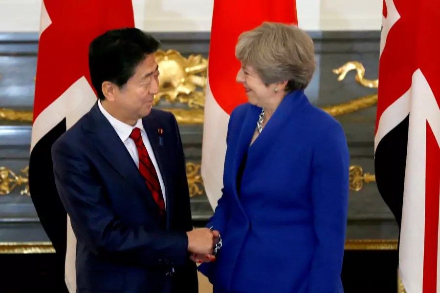 British Prime Minister Theresa May is greeted by her Japanese counterpart Shinzo Abe prior to a meeting at Akasaka Palace state guest house in Tokyo, Japan on August 31, 2017. 
