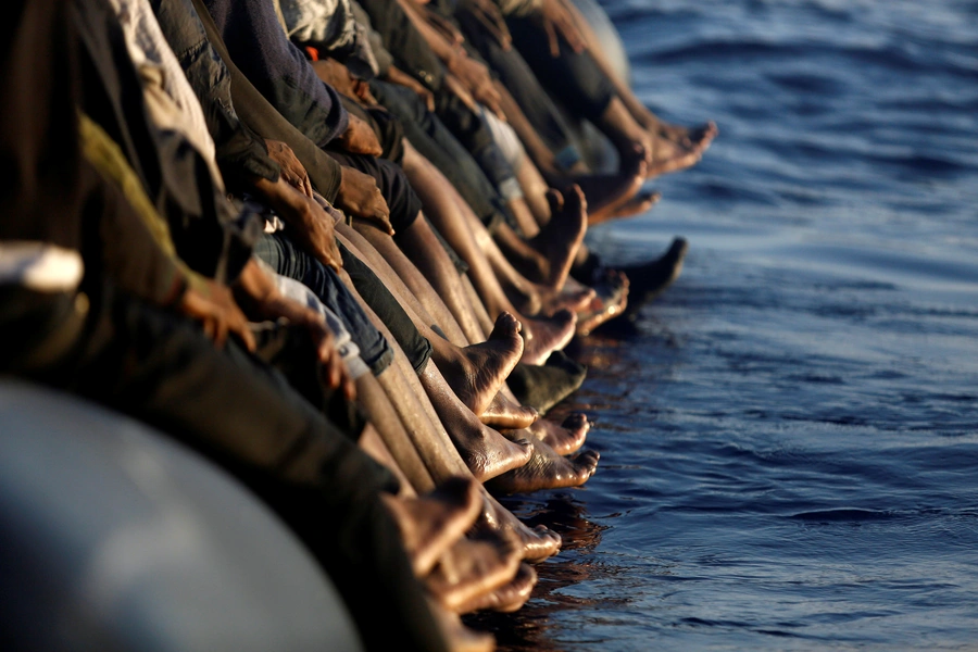 A dinghy overcrowded by African migrants is seen drifting off the Libyan coast in Mediterranean Sea August 20, 2016. The episode in Brazil appears to be the first major instance of migrants feeling to South America.