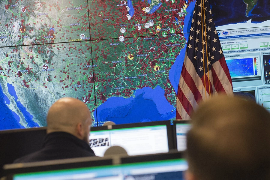 Staff members sit at their work stations at the National Cybersecurity and Communications Integration Center in Arlington, Virginia on January 13, 2015.