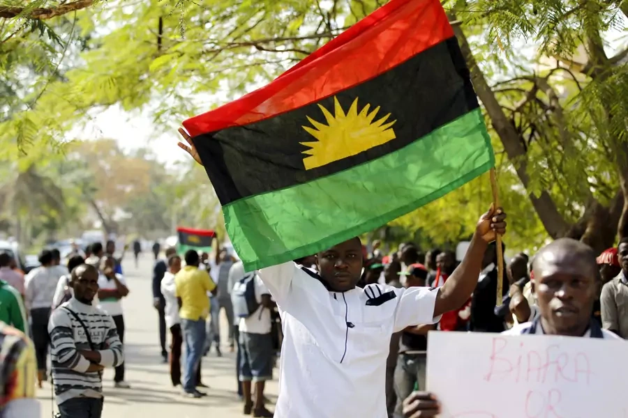 A supporter of Indigenous People of Biafra (IPOB) leader Nnamdi Kanu holds a Biafra flag during a rally in support of Kanu, who is expected to appear at a magistrate court in Abuja, Nigeria December 1, 2015. Kanu has been missing since September 2017.