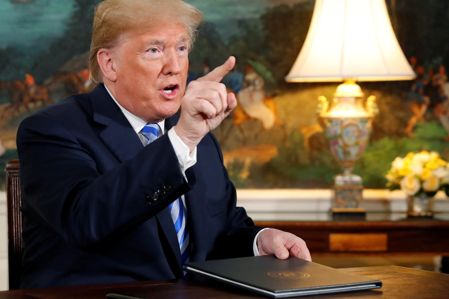 U.S. President Donald Trump speaks to reporters after signing a proclamation declaring his intention to withdraw from the JCPOA Iran nuclear agreement in the Diplomatic Room at the White House in Washington, U.S. May 8, 2018.