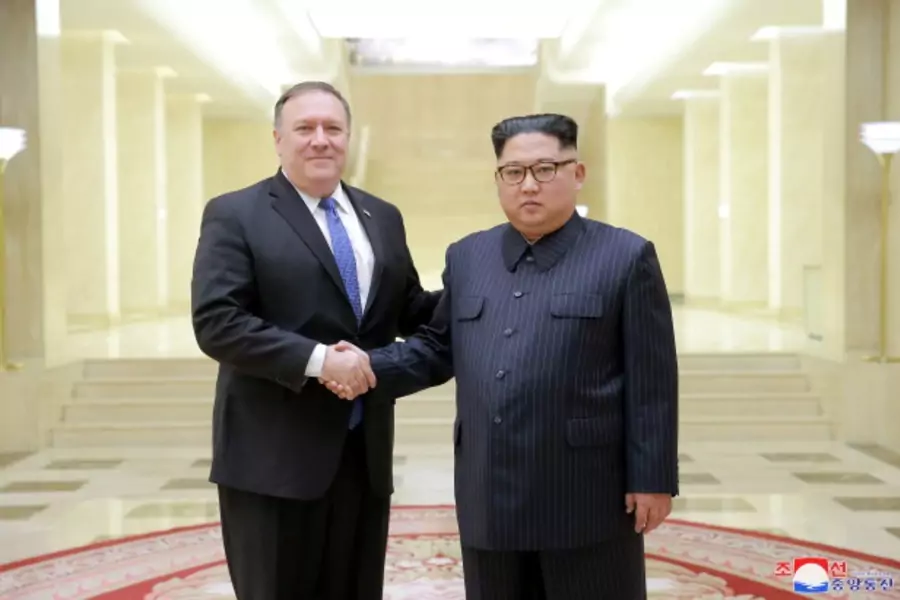 North Korean leader Kim Jong Un shakes hands with U.S. Secretary of State Mike Pompeo in this undated photo released on May 9, 2018 by North Korea's Korean Central News Agency (KCNA) in Pyongyang. 