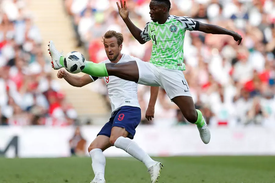 Nigeria's Kenneth Omeruo in action with England's Harry Kane Action on June 2, 2018 