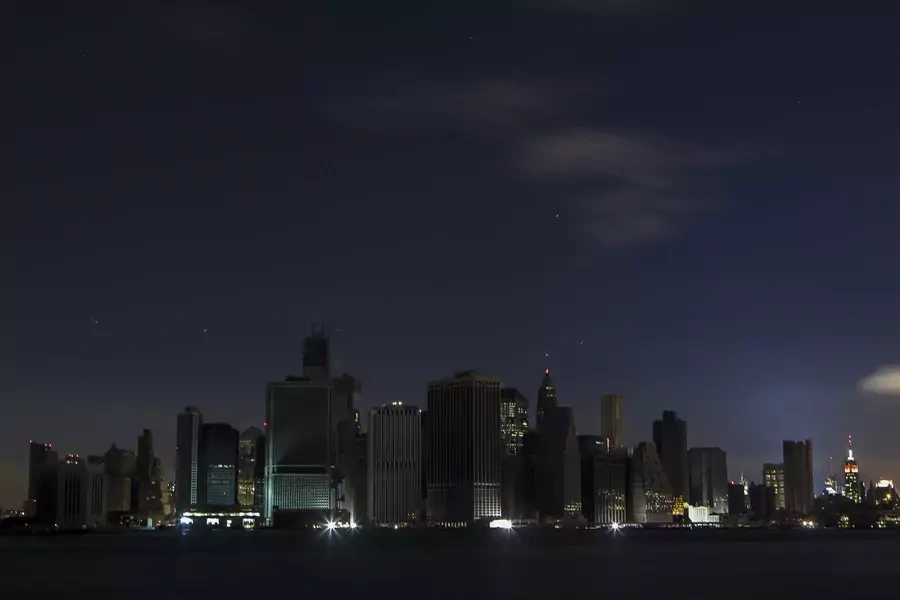 A largely powerless downtown Manhattan stands under a night sky due to a power blackout caused by Hurricane Sandy in New York October 31, 2012.