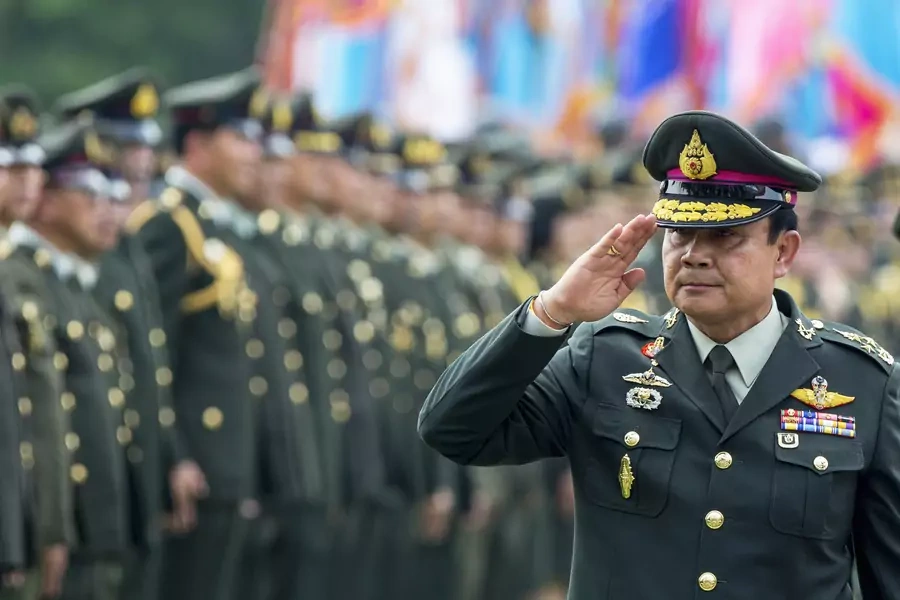 Thailand's Prime Minister Prayuth Chan-ocha salutes members of the Royal Thai Army after a handover ceremony for the new Royal Thai Army Chief, General Udomdej Sitabutr, at the Thai Army Headquarters in Bangkok on September 30, 2014.