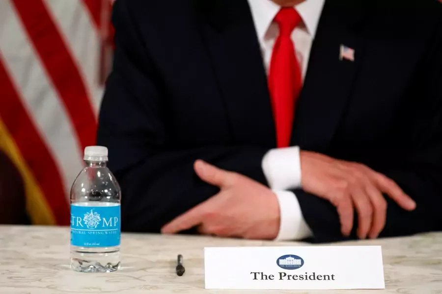 U.S. President Donald Trump, with a bottle of Trump-branded water, speaks to reporters after a security briefing at his golf estate in Bedminster, New Jersey U.S.